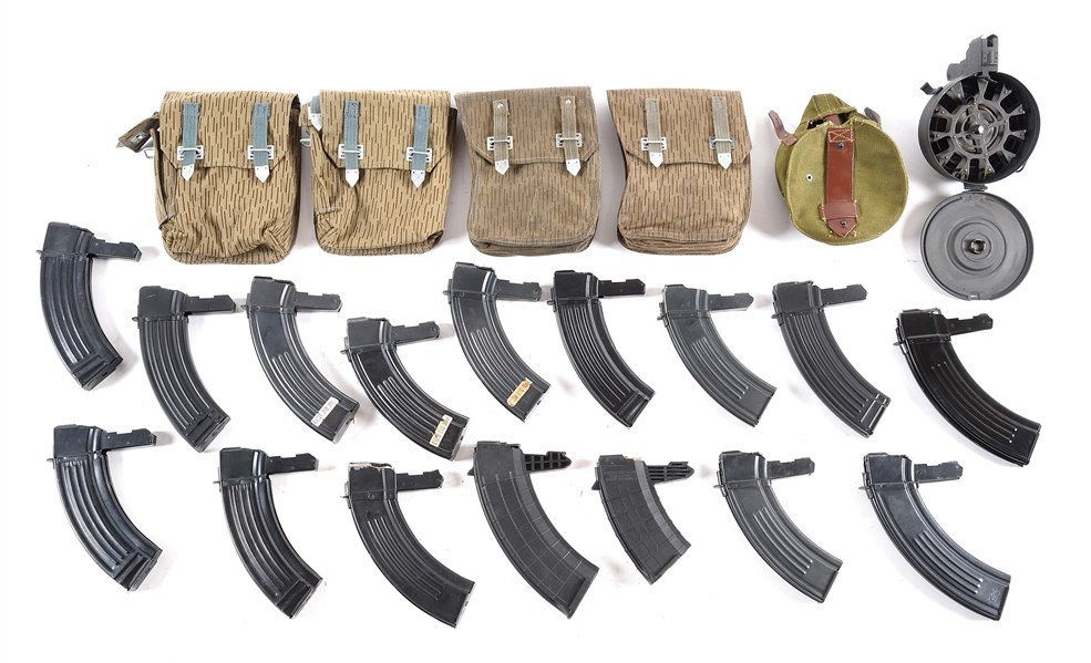 LARGE LOT OF AFTERMARKET EXTENDED SKS MAGAZINES AND POUCHES.