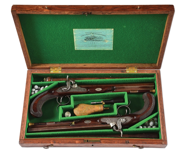 (A) A RARE PAIR OF IRISH DUELLING PISTOLS SIGNED BY BOWLS, CASED.