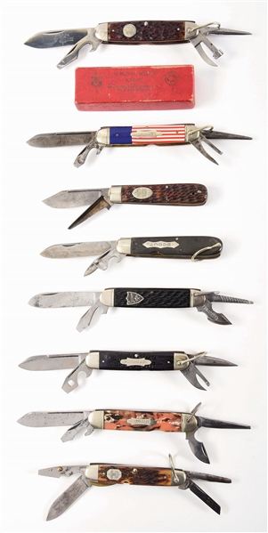 LOT OF 8: AMERICAN EARLY OFFICIAL AND UNOFFICIAL SCOUT KNIVES BY CATTAROUGUS, NYK, REMINGTON, AND OTHERS.