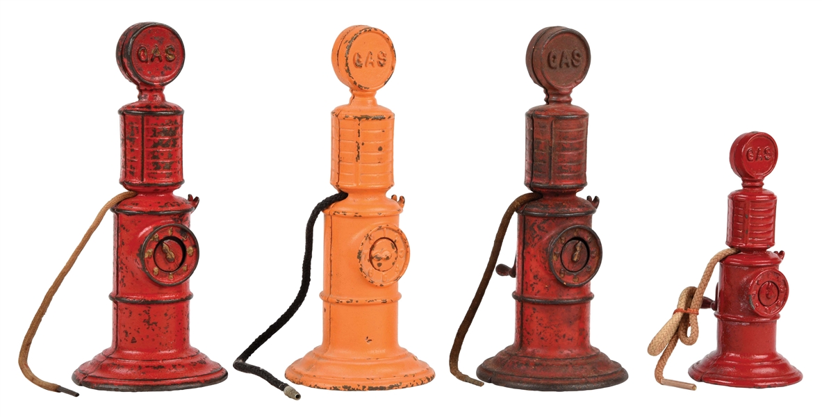 LOT OF 4: CAST-IRON ARCADE TOY GAS PUMPS.