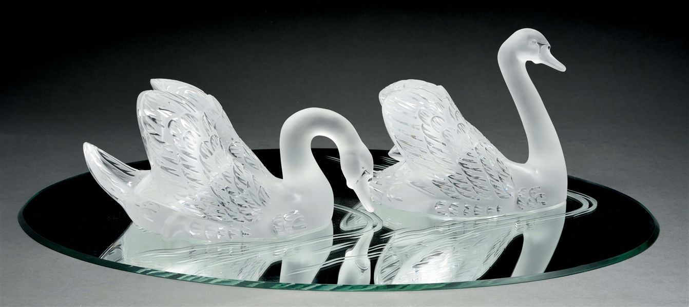 PAIR OF LALIQUE SWANS ON MIRROR.
