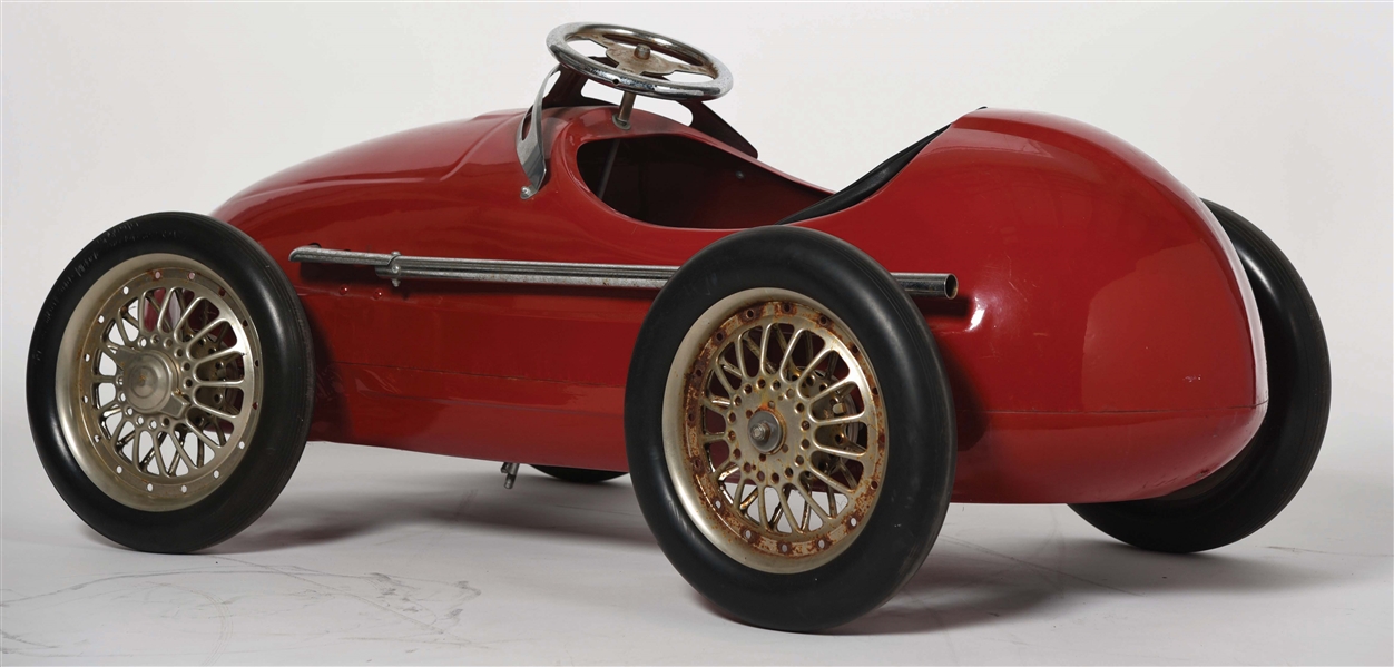 red metal pedal car