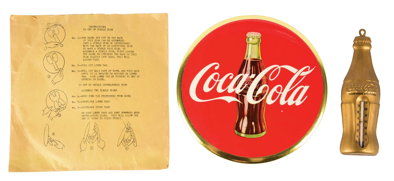 LOT OF 2: COCA-COLA SIGN IN ORIGINAL ENVELOPE AND A COCA-COLA EMBOSSED THERMOMETER.