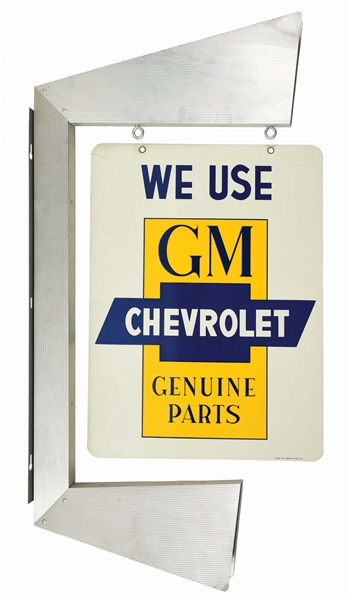 WE USE GM CHEVROLET GENUINE PARTS TIN SIGN W/ ORIGINAL ALUMINUM DISPLAY BRACKET.