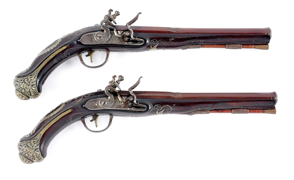 (A) LOT OF 2: A PAIR OF FLINTLOCK HOLSTER PISTOLS OF SPANISH FORM AND LIKELY MADE FOR THE MIDDLE EAST.