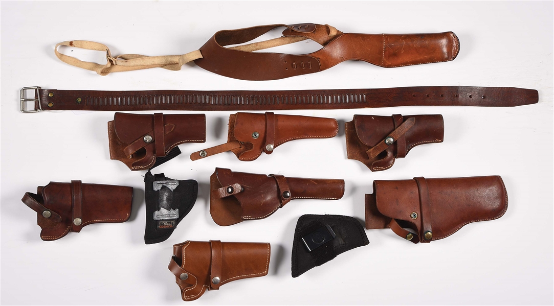 LOT OF 11: LEATHER AND SYNTHETIC HOLSTERS AND PISTOL BELTS.