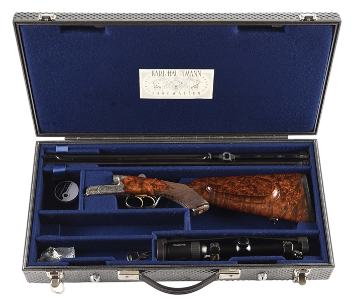 (M) KARL HAUPTMANN DOUBLE RIFLE IN 9.3X74R WITH SWAROVSKI GLASS, ENGRAVED BY ARMIN BUNDSCHUH, AND CASE.