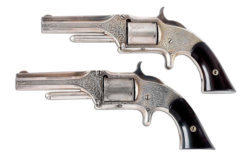 (A) PAIR OF ACID ETCHED ENGRAVED SMITH AND WESSON NO. 1 - 1/2 REVOLVERS IN PERIOD DEALER CASE.