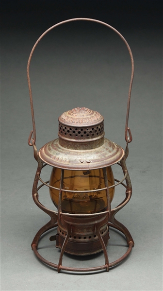 T. & P. RY. HANDLAN BUCK "THE HANDLAN" RAILROAD LANTERN WITH AMBER EMBOSSED GLOBE.