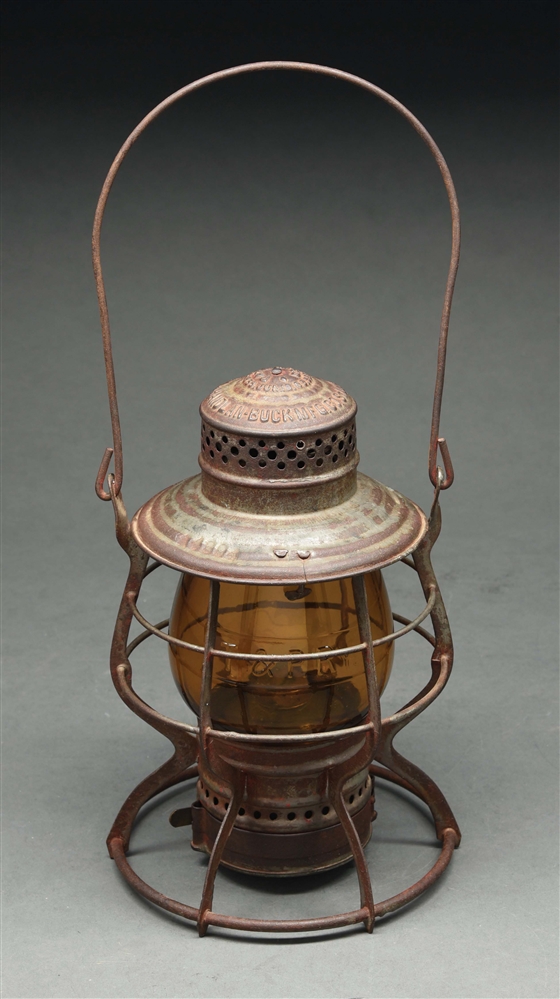 T. & P. RY. HANDLAN BUCK "THE HANDLAN" RAILROAD LANTERN WITH AMBER EMBOSSED GLOBE.
