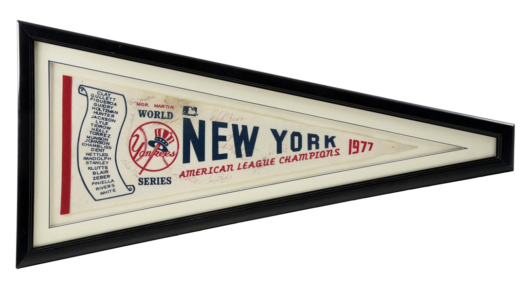 NICELY FRAMED 1977 NEW YORK YANKEES AMERICAN LEAGUE CHAMPIONS AUTOGRAPHED PENDANT.