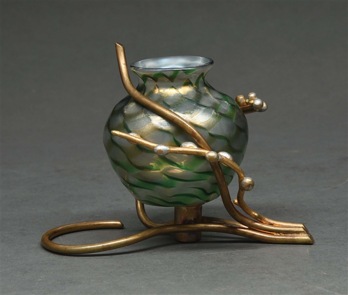 DECORATED TIFFANY VASE IN A BRONZE MOUNT.