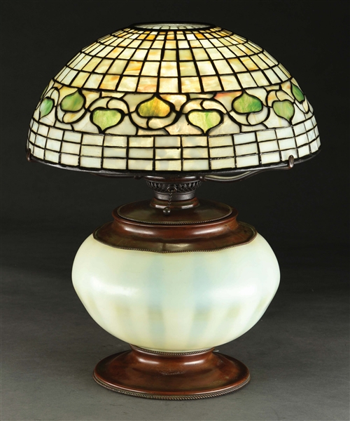 TIFFANY STUDIOS LEAF AND VINE LEADED GLASS TABLE LAMP WITH FAVRILE GLASS BASE.