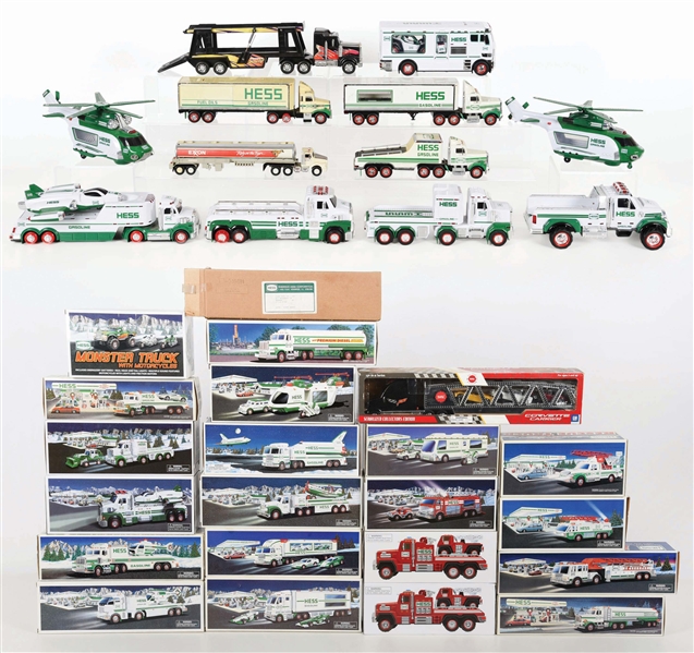 LARGE LOT OF APPROXIMATELY 30 CONTEMPORARY HESS PLASTIC TRUCKS AND OTHER VEHICLES.