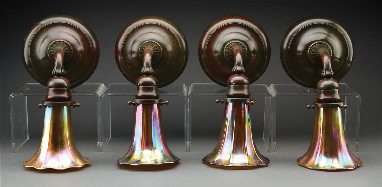 SET OF FOUR TIFFANY STUDIOS SCONCES WITH FAVRILE GLASS SHADES.