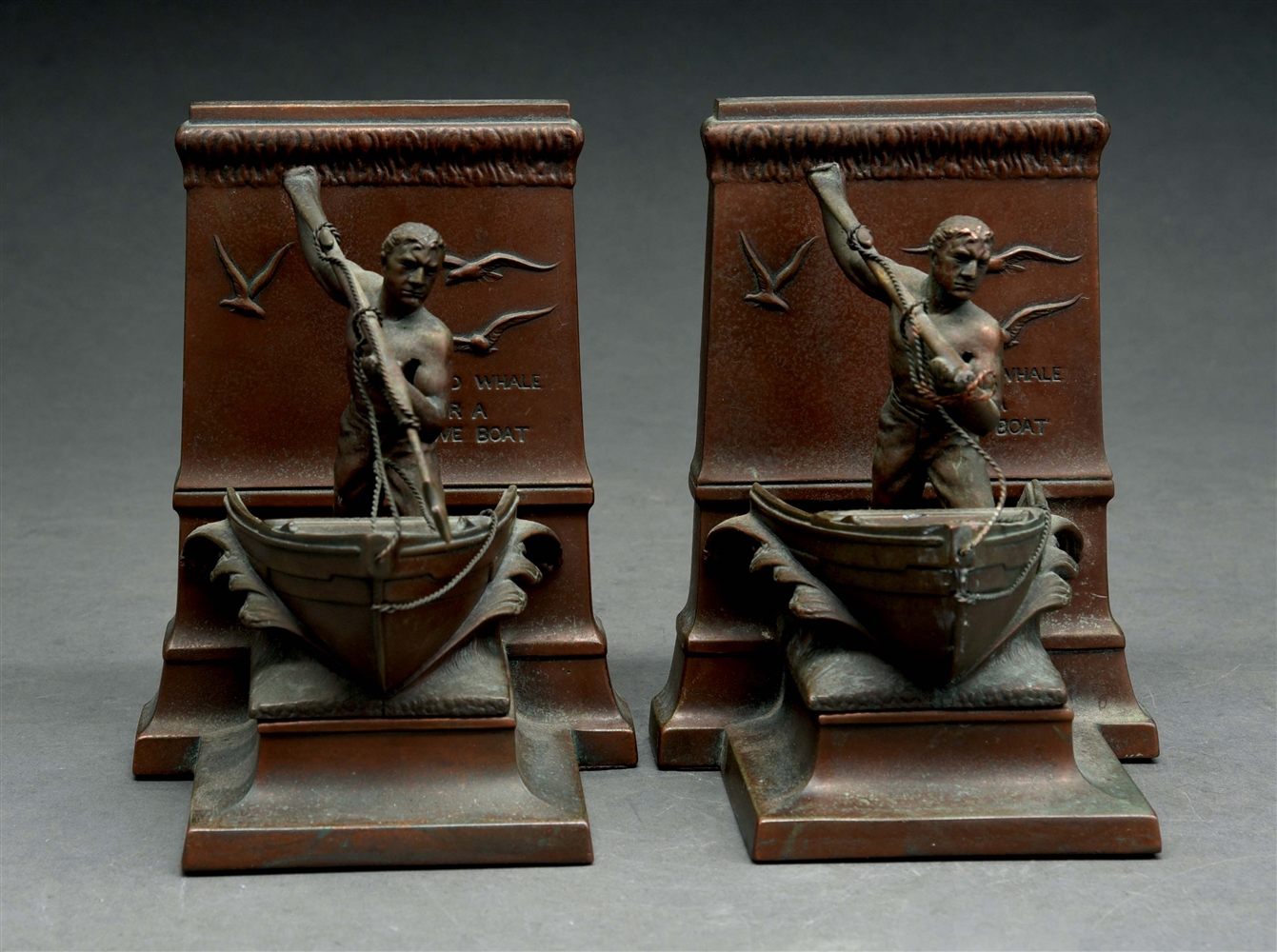 PAIR OF BRONZE BOOKENDS.