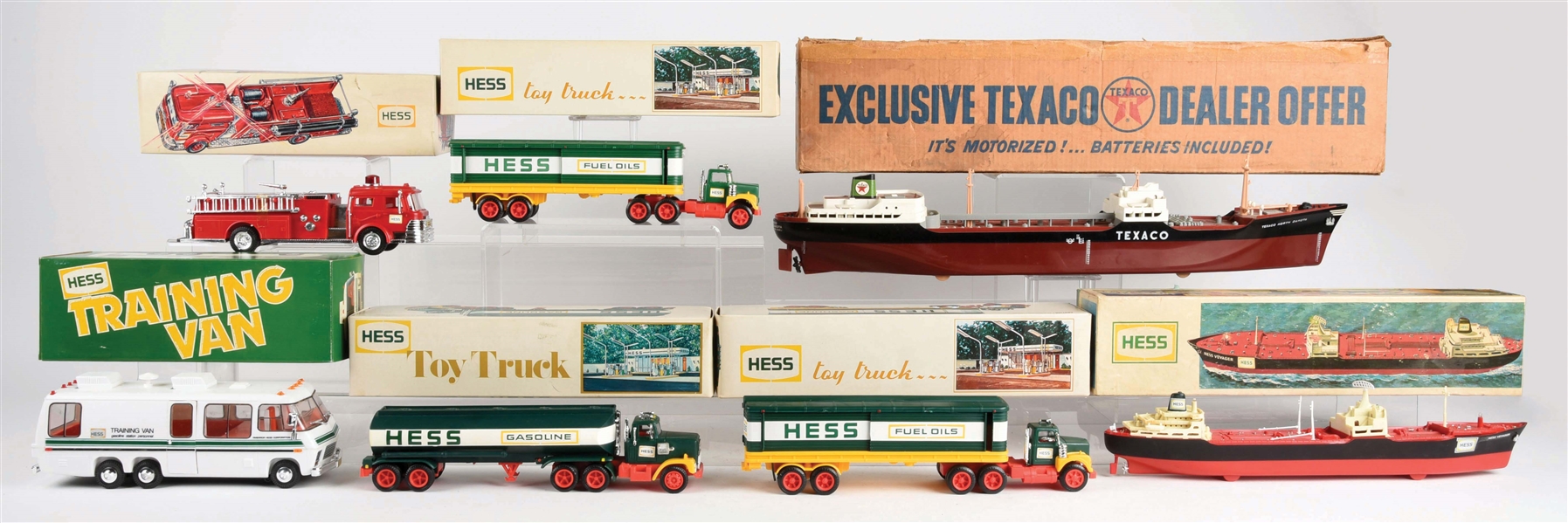LOT OF 7: PLASTIC POST-WAR HESS AND TEXACO TOY VEHICLES.