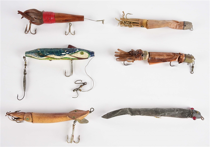 LOT OF 6: SQUID LURES IN DISPLAY.