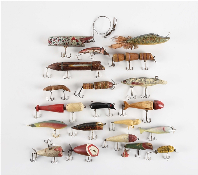 LARGE LOT OF APPROXIMATELY 20 HAND-CARVED FOLK ART-TYPE FISHING LURES.