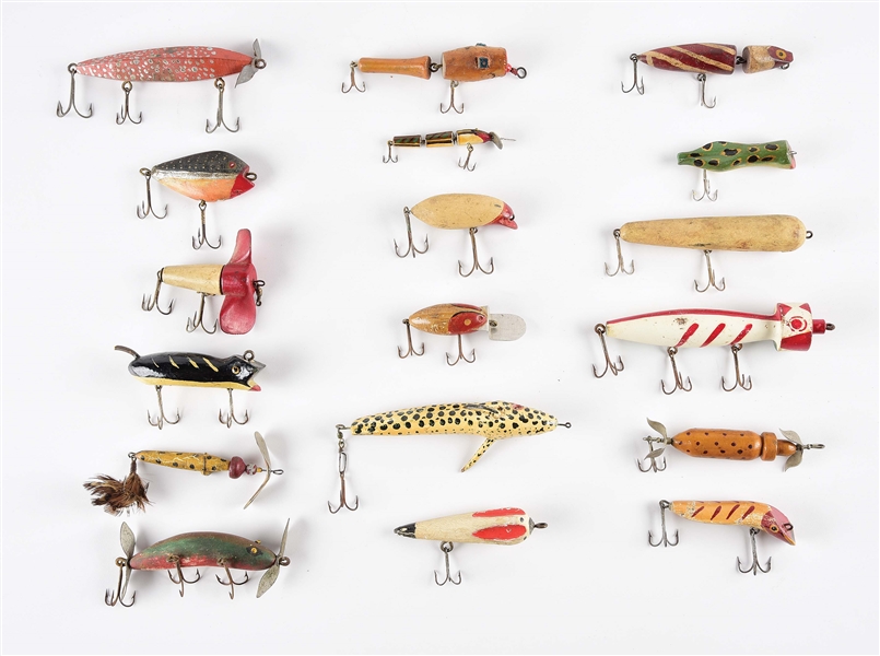 LARGE LOT OF APPROXIMATELY 20 HAND-CARVED FOLK ART TYPE FISHING LURES.