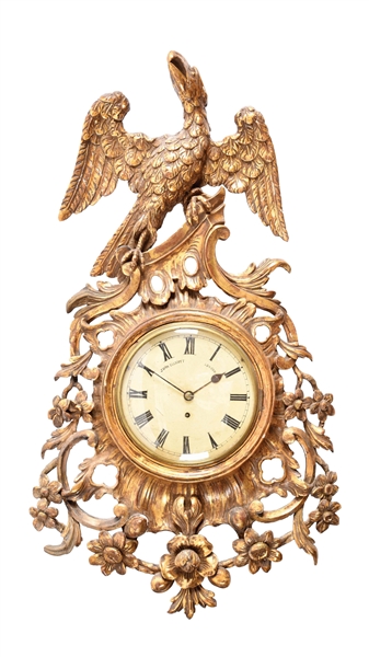 LARGE CARVED WOOD AND GILDED WALL CLOCK.