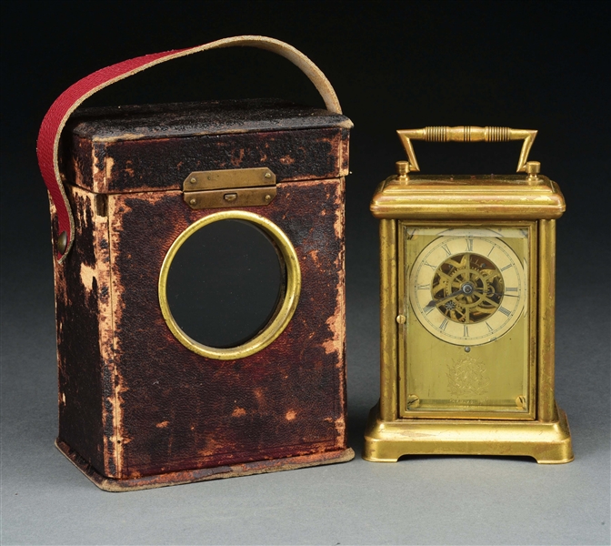 CARRIAGE CLOCK WITH LEATHER STRAP.