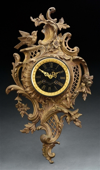 BRONZE CLOCK WITH BLACK GLASS FACE.