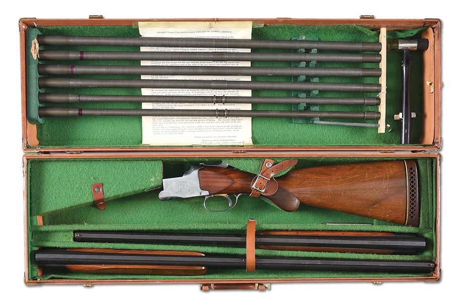 (C) CASED BROWNING SUPERPOSED 12 BORE OVER UNDER SHOTGUN WITH BARREL INSERTS.