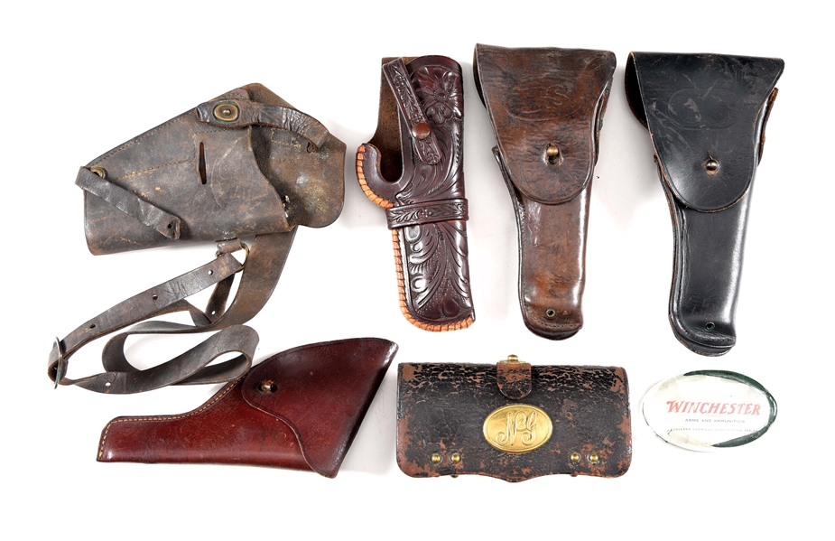 LOT OF 7: 5 HOLSTERS, M1872 FRAZIER’S CARTRIDGE BOX, AND WINCHESTER PAPERWEIGHT.