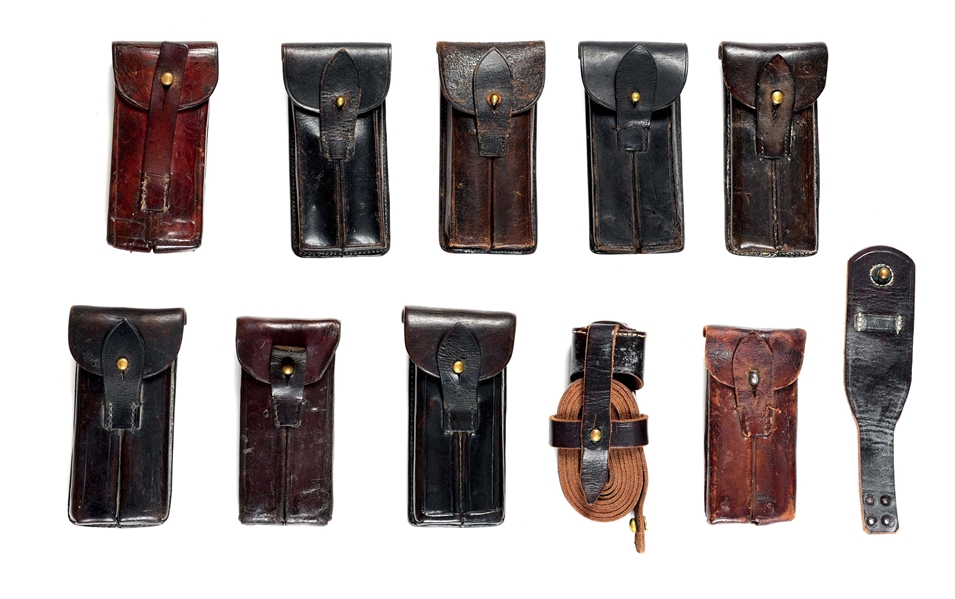 LOT OF 11 LUGER MAGAZINE POUCHES AND STOCK LEATHER. 