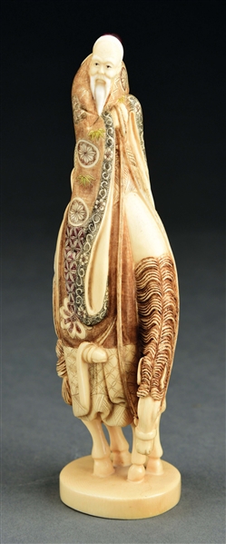 IVORY FIGURE OF MAN RIDING HORSE. 