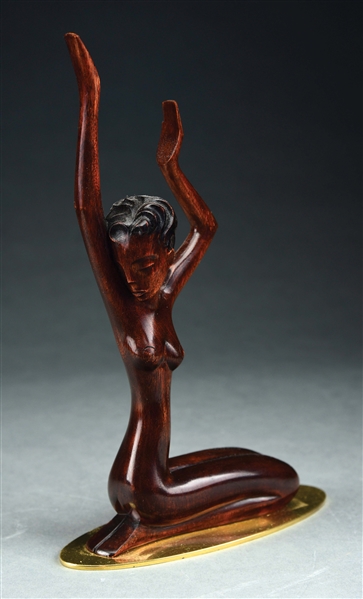HAGENAUER CARVED WOODEN FIGURE OF WOMAN ON BRASS BASE.