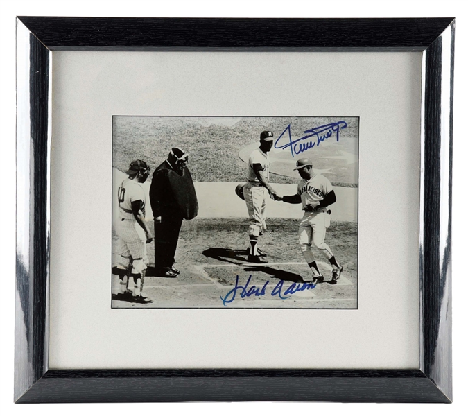 FRAMED FACSIMILE PHOTOGRAPH OF WILLIE MAYS AND HANK AARON, BOTH SIGNED IN BLUE MARKER.