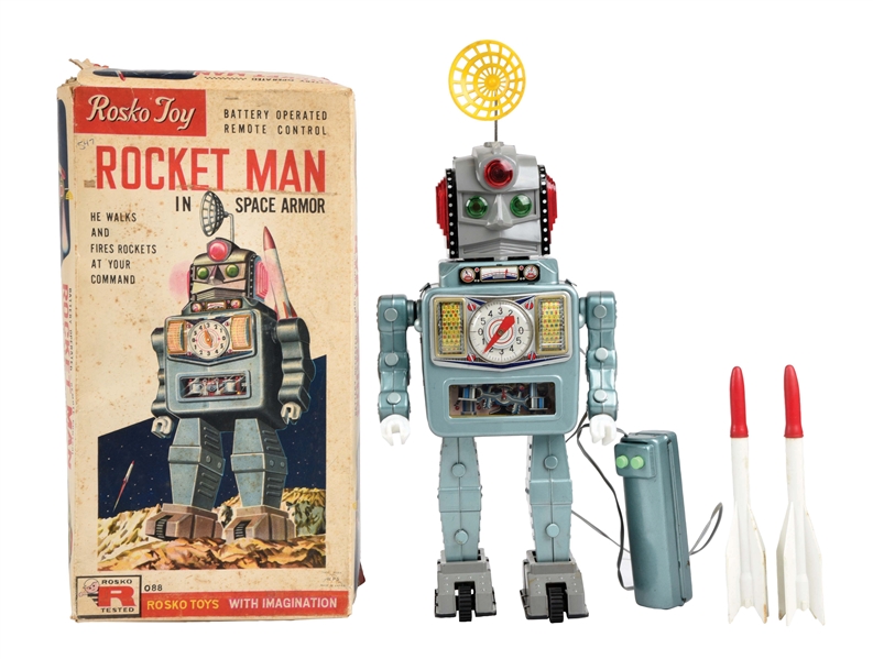 JAPANESE TIN LITHO AND PLASTIC BATTERY OPERATED REMOTE CONTROL ROCKET MAN TOY ROBOT IN ORIGINAL BOX.