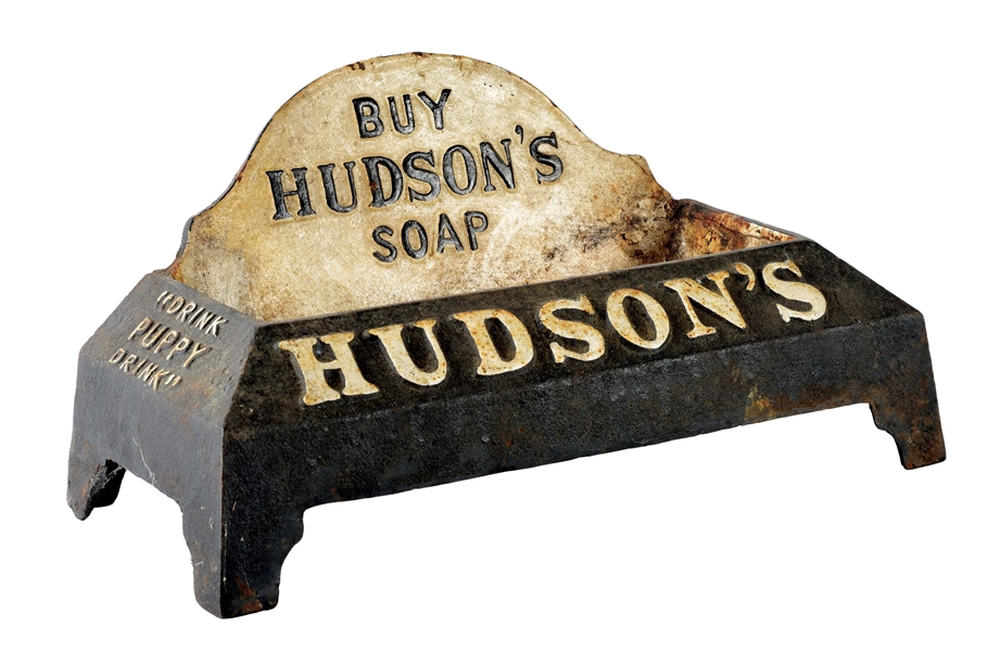 AN ORIGINAL HUDSONS SOAP CAST-IRON DOG WATER HOLDER.