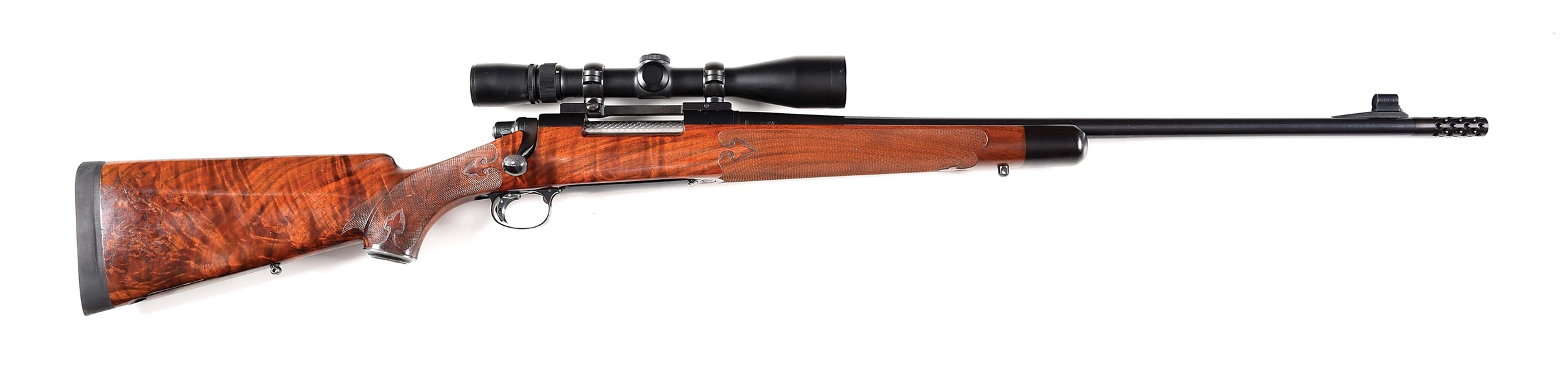 (M) REMINGTON MODEL 700 CUSTOM DELUXE BOLT ACTION RIFLE WITH SCOPE.