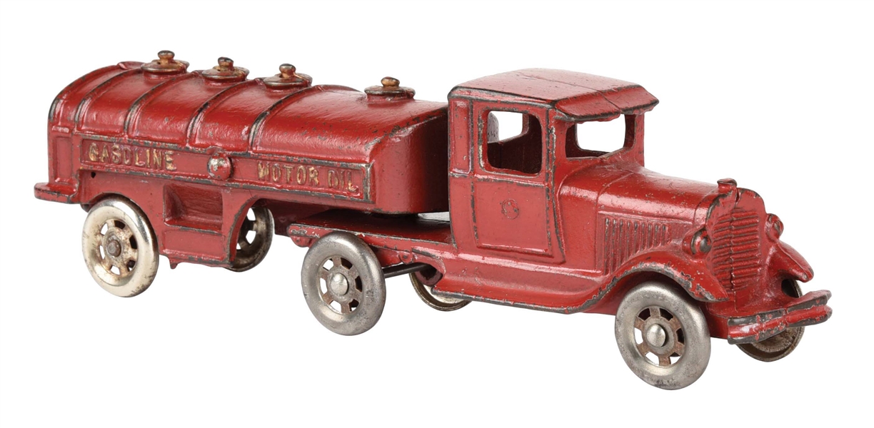 CAST IRON AMERICAN MADE GASOLINE AND MOTOR OIL TRUCK.