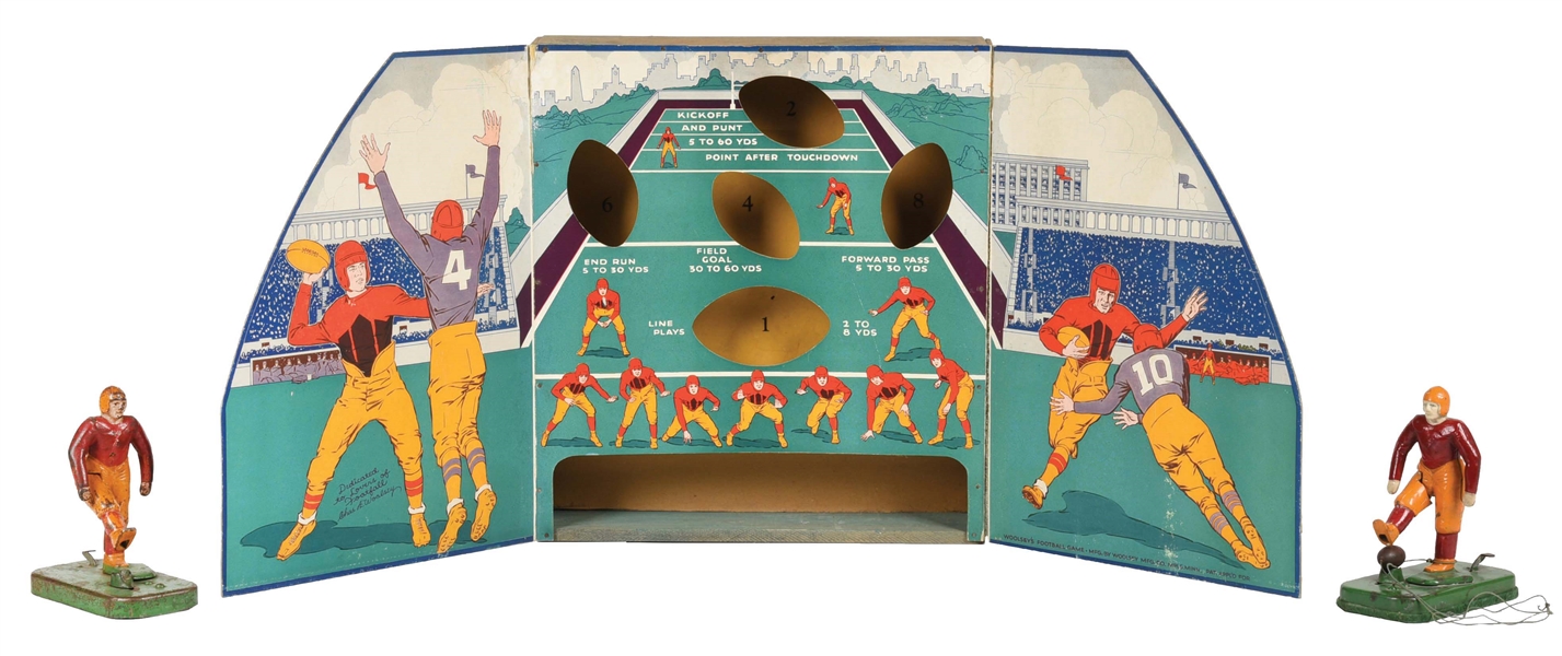 CAST IRON AND LITHOGRAPHED CARDBOARD WOOLSEY FOOTBALL KICKING GAME.