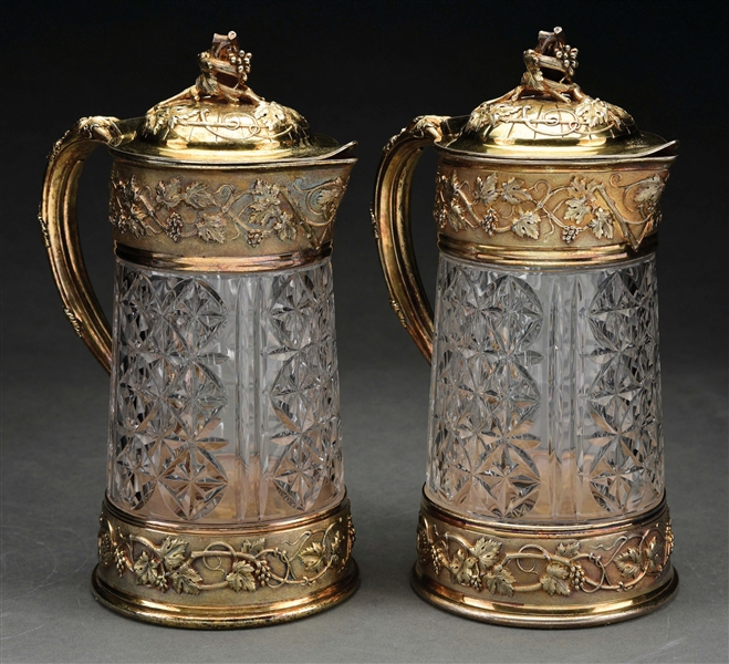 A PAIR OF FRENCH SILVER-GILT MOUNTED CUT GLASS JUGS.