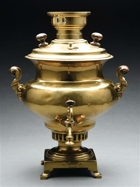 EARLY BRASS COFFEE DISPENSER WITH WOODEN HANDLES.