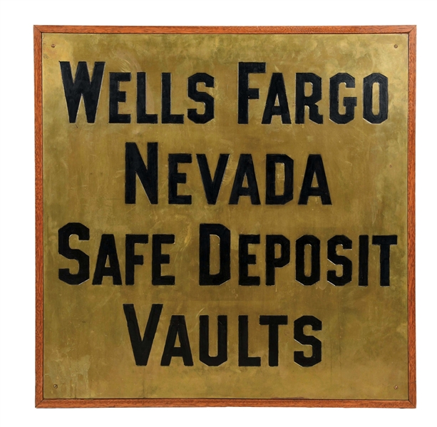 WELLS FARGO NEVADA SAFETY DEPOSIT VAULTS STAMPED BRASS SIGN W/ WOOD FRAME. 
