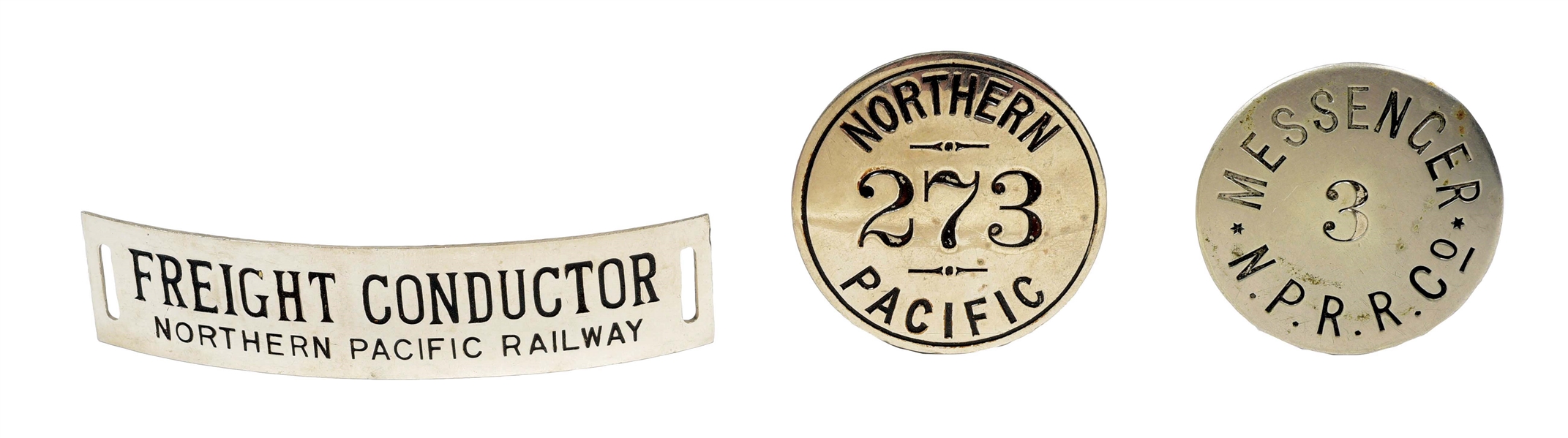 LOT OF 3: NORTHERN PACIFIC BADGES.