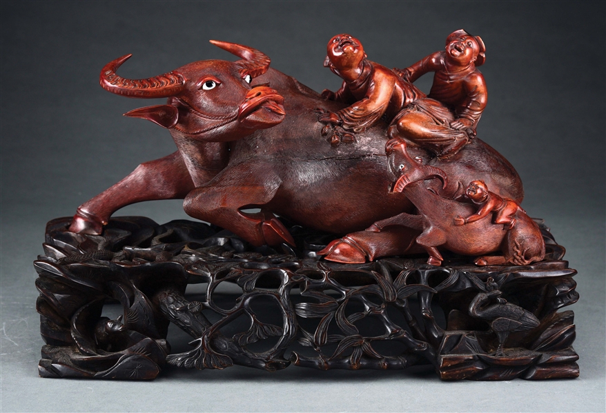 HIGHLY CARVED WATER BUFFALO WITH SMALL BUFFALO.