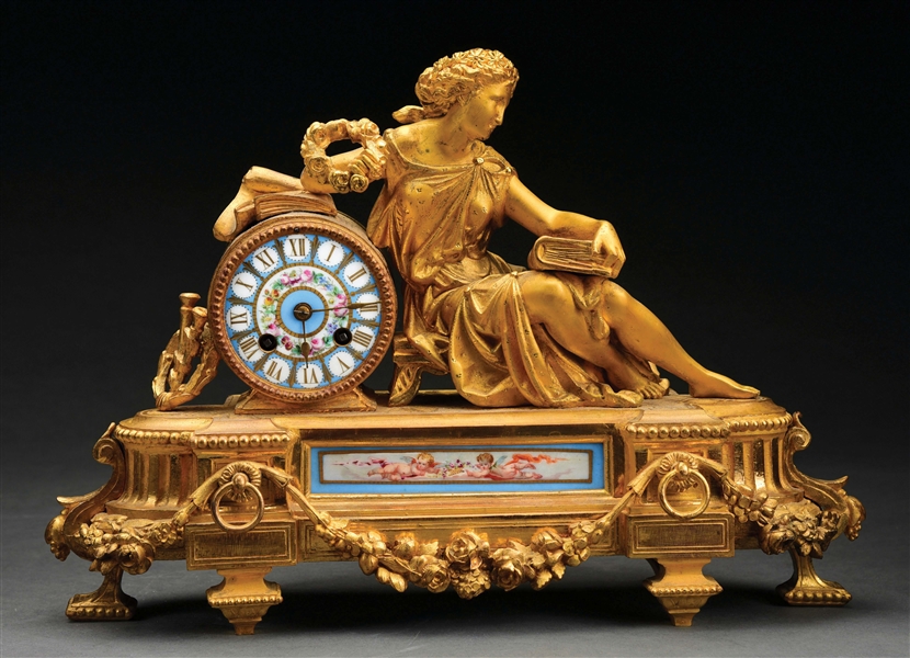 GILDED CCLOCK WITH RECLINING GODDESS.