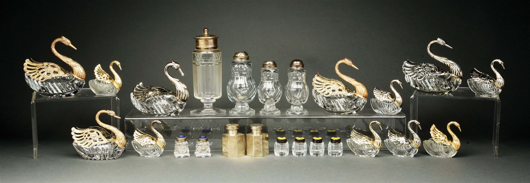 A GROUP OF STERLING AND GLASS SWAN SALT CELLARS.