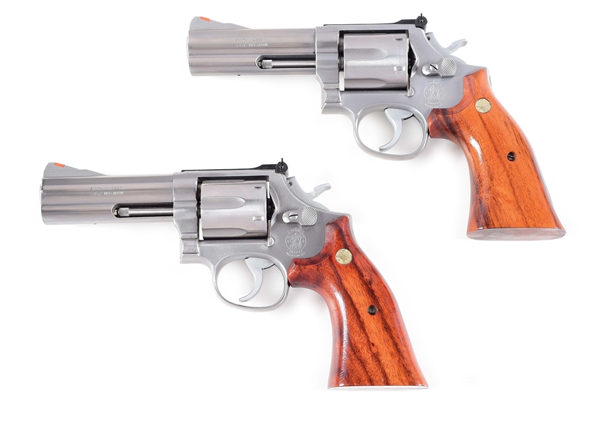 (M) LOT OF 2: SMITH & WESSON MODEL 686 CAPTAIN DAN COMBS COMMEMORATIVE REVOLVERS WITH BOXES AND CASES.