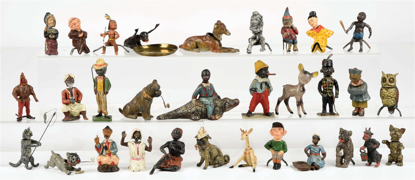 LARGE LOT OF FIGURAL CAST-IRON AND POT METAL FIGURINES.