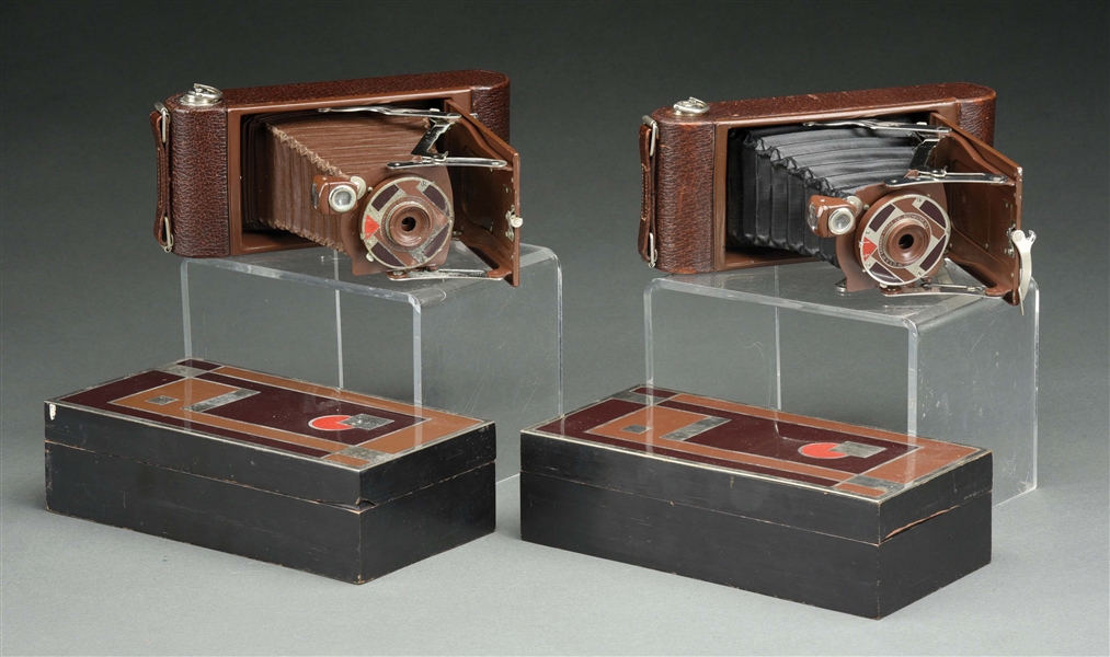 PAIR OF KODAK GIFT CAMERAS DESIGNED BY WALTER DORWIN TEAGUE WITH BOXES.
