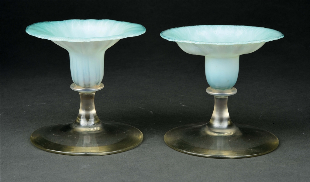 PAIR OF TIFFANY STUDIOS FAVRILE GLASS CANDLESTICKS.