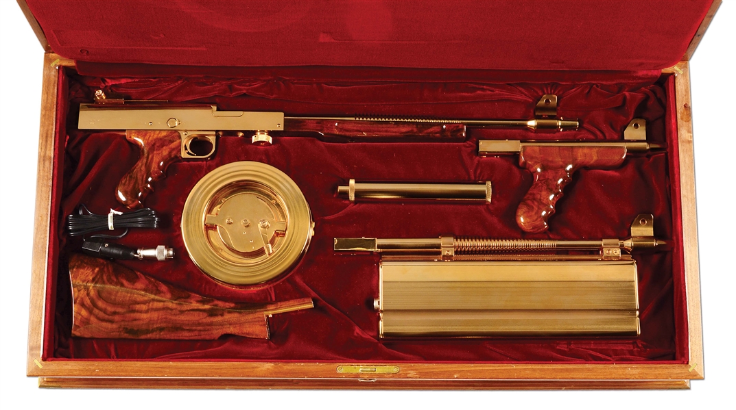 (N) MAGNIFICENT UNFIRED GOLD PLATED AMERICAN ARMS AMERICAN 180 M2 MACHINE GUN WITH LASER-LOK SIGHT AND SILENCER (FULLY TRANSFERABLE).